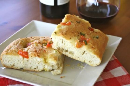 Focaccia with tomato, green onion, and garlic