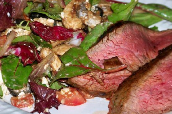 Flank steak with garlicky mediterranean salad