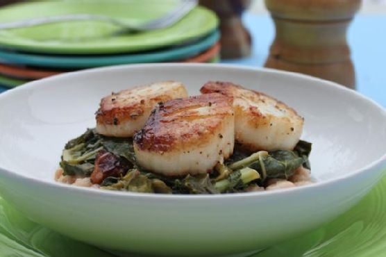 Seared scallops with wilted greens