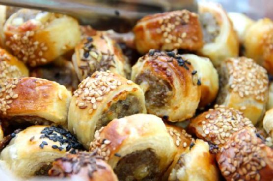 Party sausage bites with pine nuts