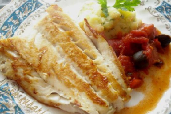 Cod with tomato-olive-chorizo sauce and mashed potatoes