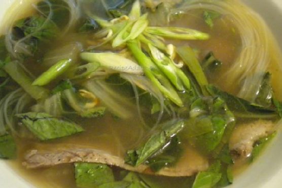 Vietnamese beef-noodle soup with asian greens