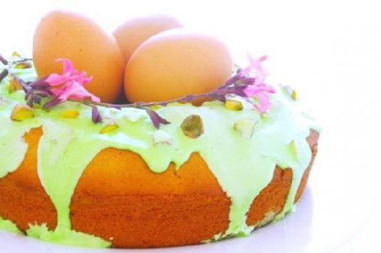 Easter nest sweet cake with sour cream-royal icing and pistachios