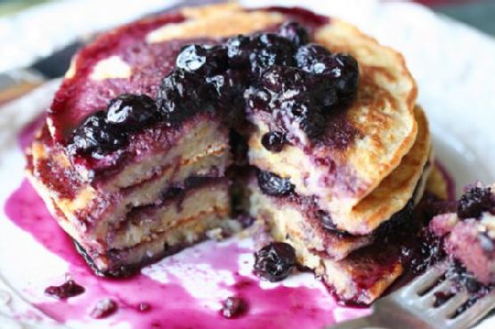 Lemon scented polenta pancakes with blueberry thyme syrup