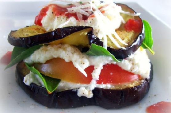 Grilled eggplant and heirloom tomato stacks with basil and tomato coulis