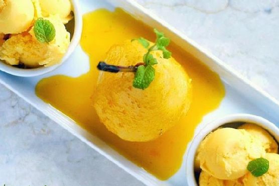 Classy poached pear with mango ice cream